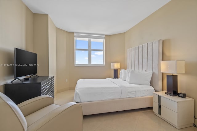 bedroom featuring light tile patterned flooring