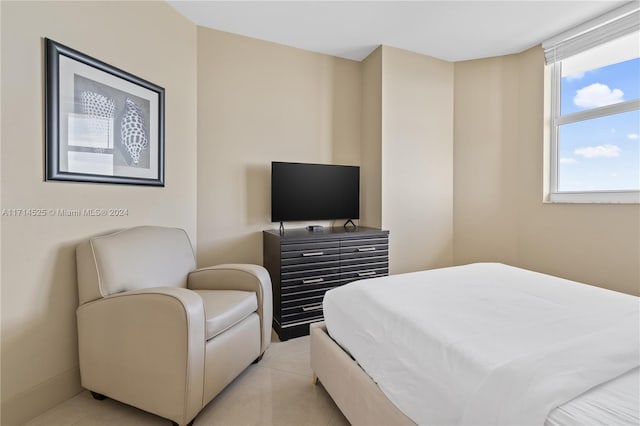 bedroom with light tile patterned floors