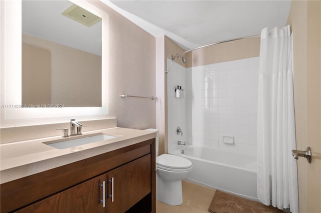 full bathroom featuring toilet, vanity, tile patterned floors, and shower / tub combo with curtain