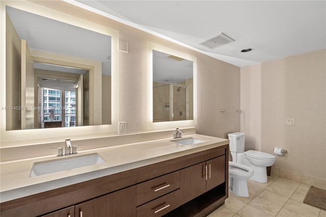 bathroom featuring vanity, a bidet, tile patterned floors, toilet, and an enclosed shower