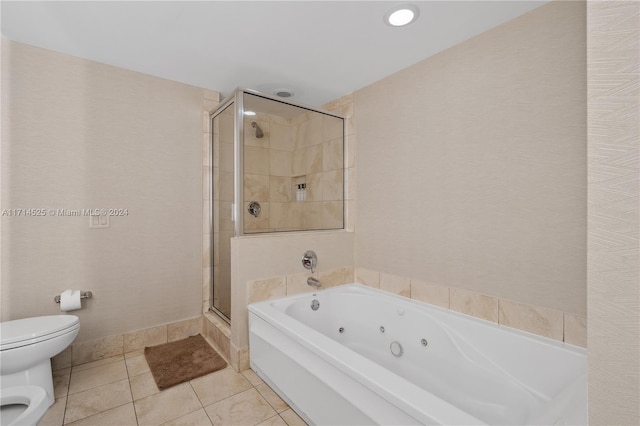 bathroom with tile patterned flooring, toilet, and plus walk in shower