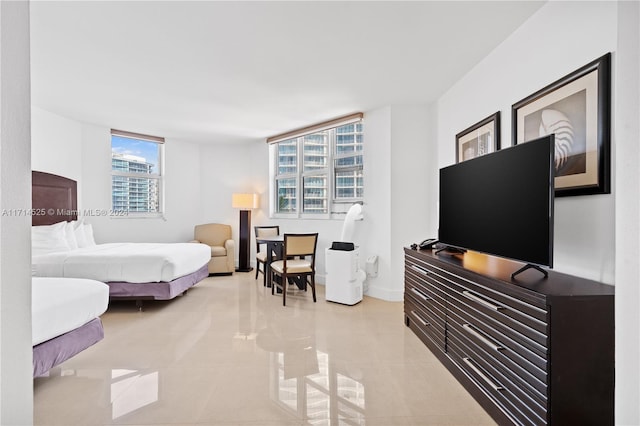 tiled bedroom featuring multiple windows