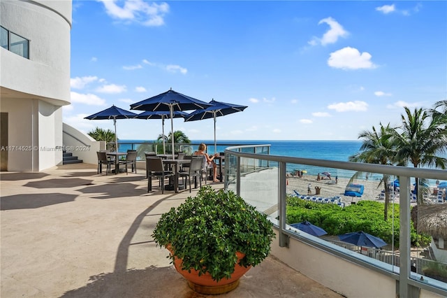 view of patio / terrace featuring a balcony and a water view