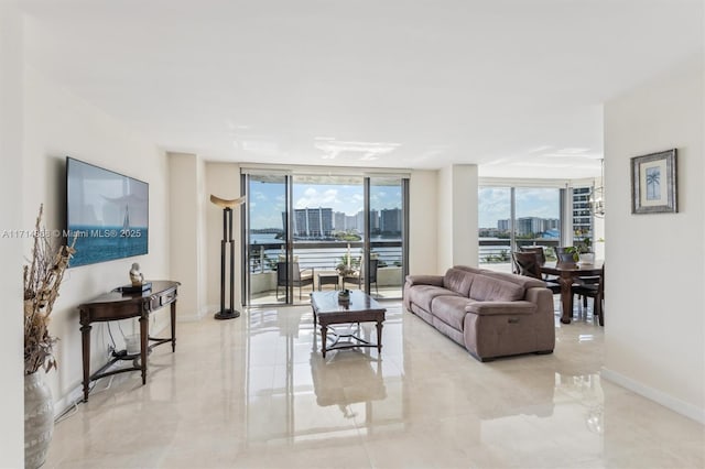 living room with plenty of natural light and expansive windows