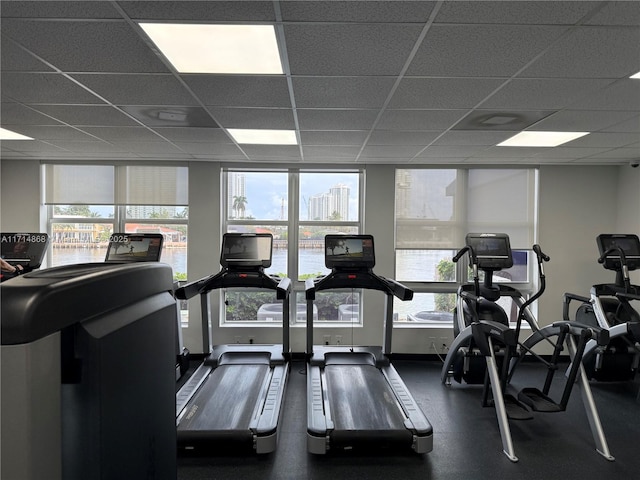 exercise room featuring a paneled ceiling