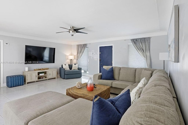 tiled living room with ceiling fan