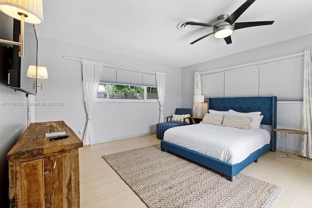 bedroom featuring ceiling fan and wood-type flooring