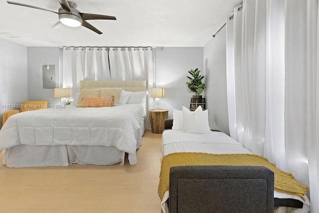 bedroom featuring ceiling fan and light hardwood / wood-style floors