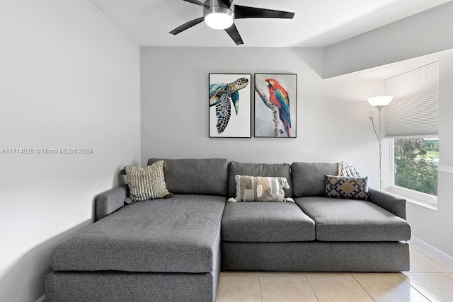 living room featuring ceiling fan and light tile patterned floors