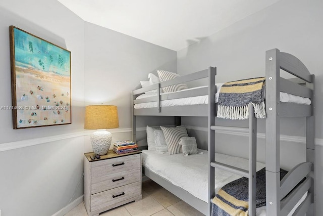 bedroom with light tile patterned floors