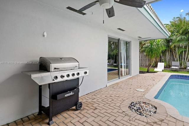 view of patio / terrace with grilling area and ceiling fan