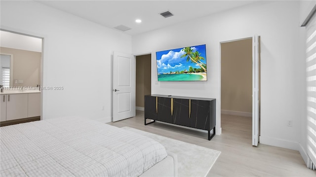 bedroom featuring light hardwood / wood-style floors