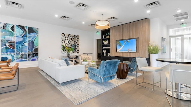 living room with light hardwood / wood-style flooring