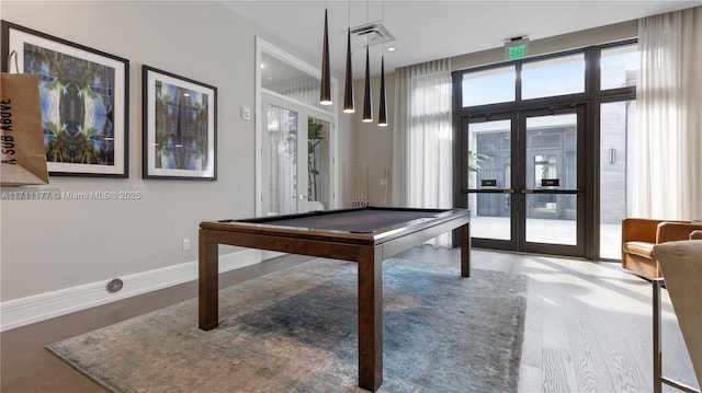 recreation room featuring french doors, pool table, and hardwood / wood-style flooring