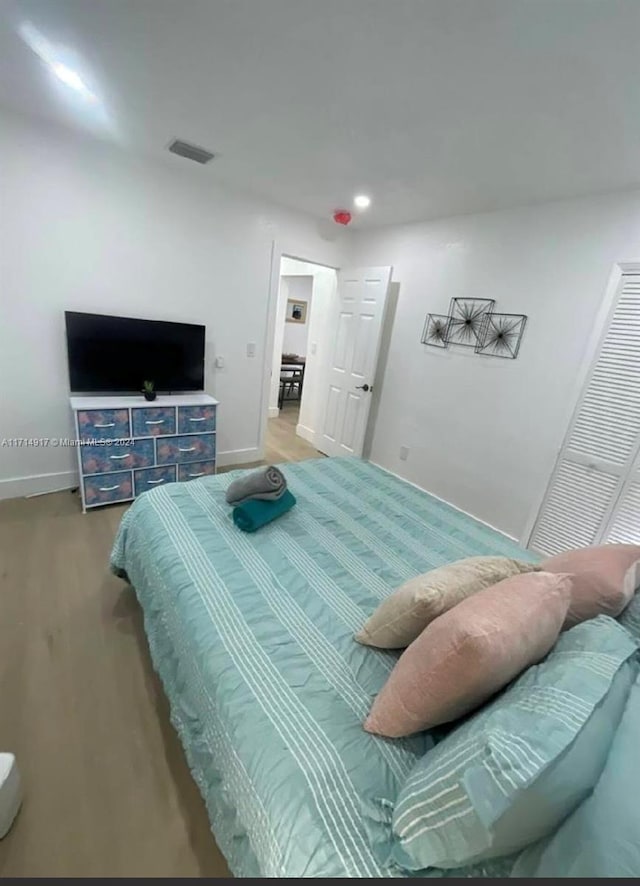 bedroom featuring wood-type flooring