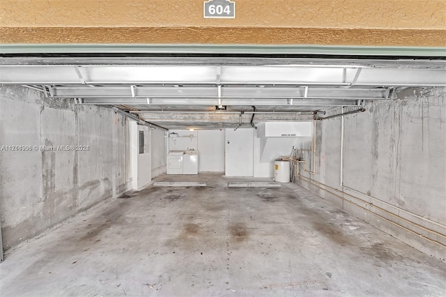 garage featuring washing machine and dryer