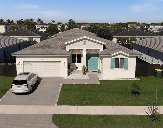 single story home featuring a front yard and a garage