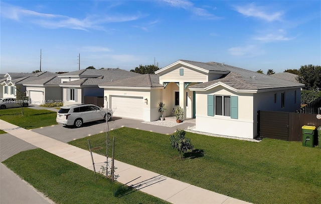 single story home with a front yard and a garage