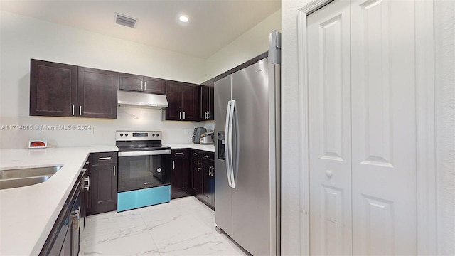 kitchen featuring appliances with stainless steel finishes and dark brown cabinets