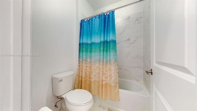 bathroom featuring toilet and shower / tub combo with curtain