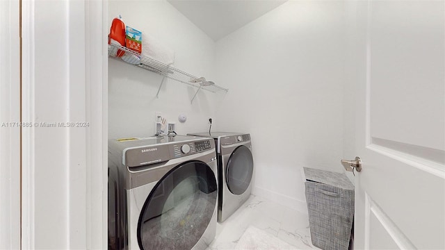 laundry room with separate washer and dryer