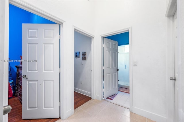 hallway with light tile patterned floors