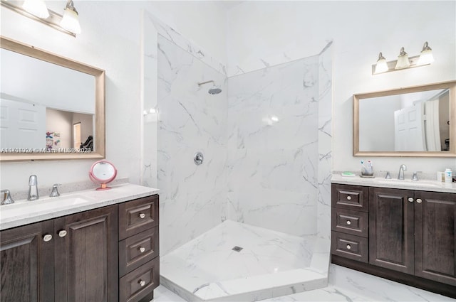 bathroom featuring vanity and a tile shower