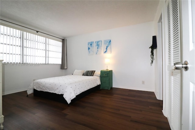 bedroom featuring dark hardwood / wood-style flooring