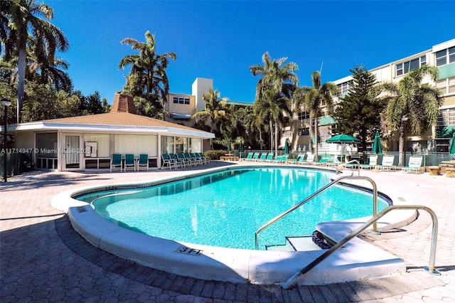 view of pool featuring a patio and french doors