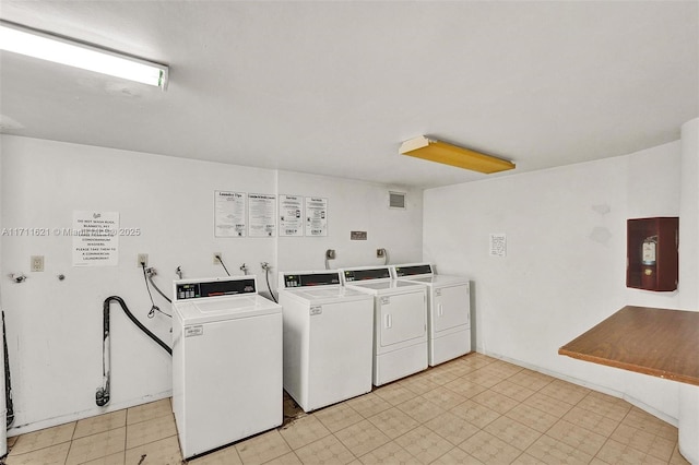 laundry room with washing machine and clothes dryer