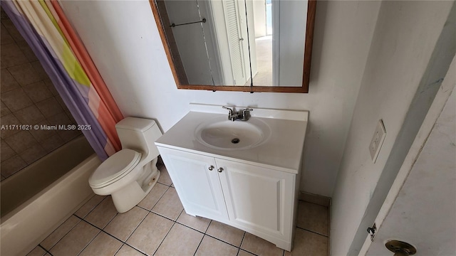 full bathroom with vanity, shower / tub combo, tile patterned floors, and toilet