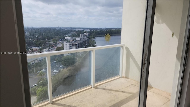 balcony featuring a water view