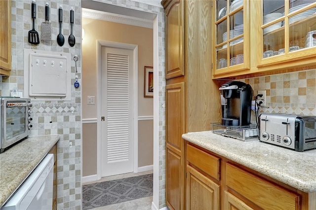 kitchen with white dishwasher and crown molding