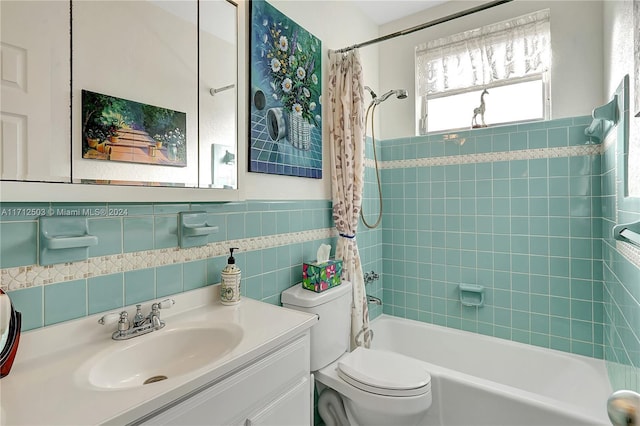 full bathroom with vanity, toilet, shower / bathtub combination with curtain, and tile walls