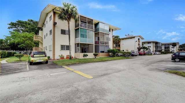 16750 NE 14th Ave Unit 212, Miami, FL 33162 - view of property featuring uncovered parking