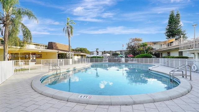 view of swimming pool featuring a patio