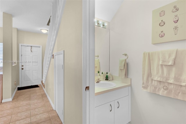 bathroom with tile patterned floors and vanity