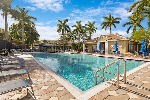 view of swimming pool featuring a patio area