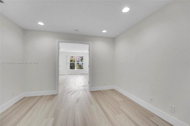 unfurnished room featuring light wood-type flooring