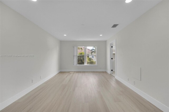 spare room featuring light hardwood / wood-style flooring