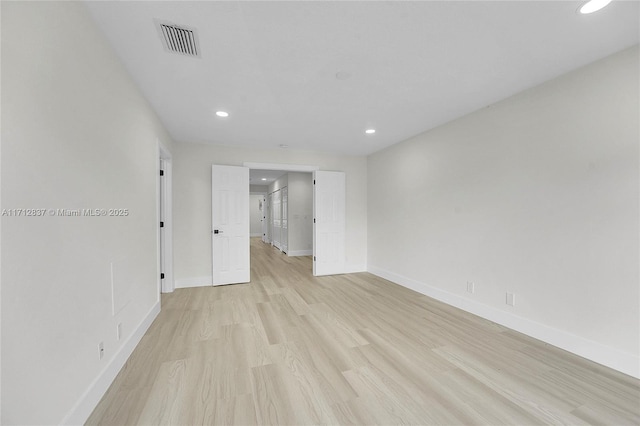 unfurnished room featuring light hardwood / wood-style floors