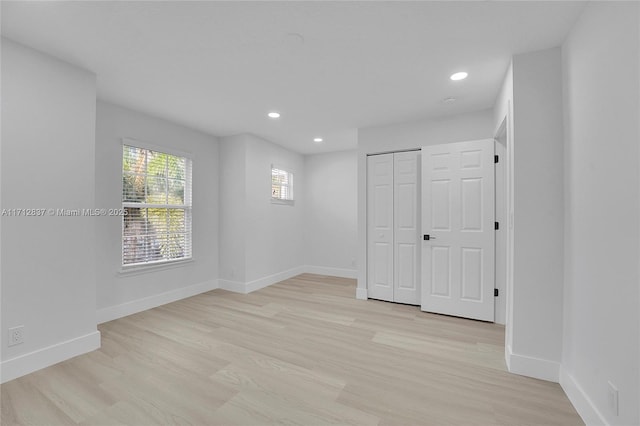 unfurnished room featuring light wood-type flooring