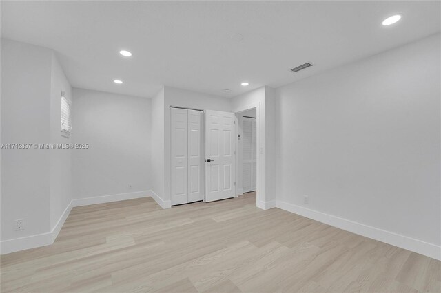 unfurnished room featuring light hardwood / wood-style floors