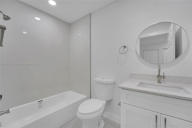 full bathroom featuring vanity, toilet, and tiled shower / bath combo