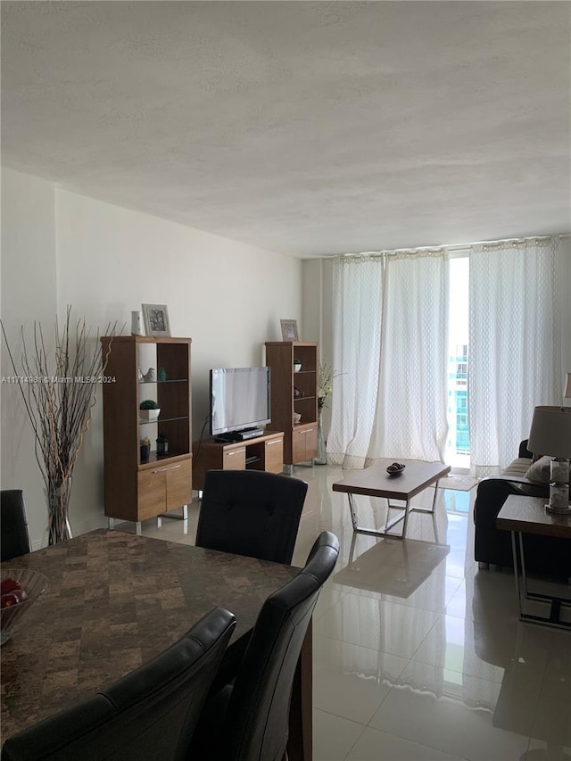 dining area featuring light tile patterned floors