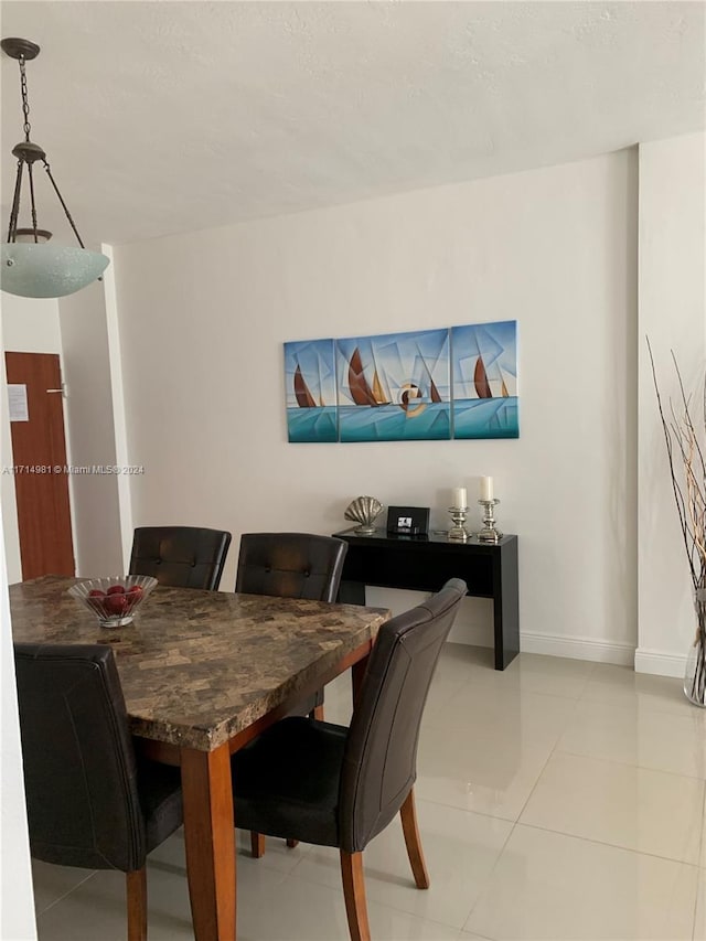 dining room featuring light tile patterned flooring