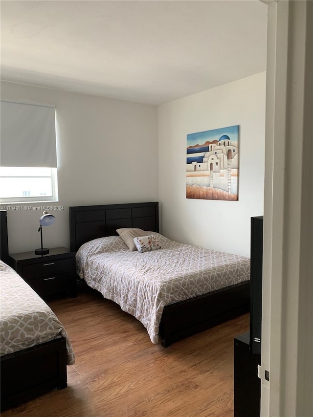 bedroom featuring hardwood / wood-style floors