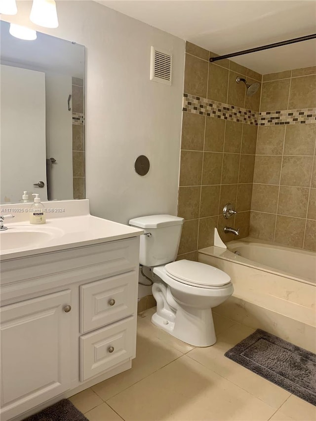 full bathroom with tile patterned floors, vanity, toilet, and tiled shower / bath