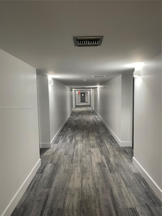 hallway featuring dark wood-type flooring