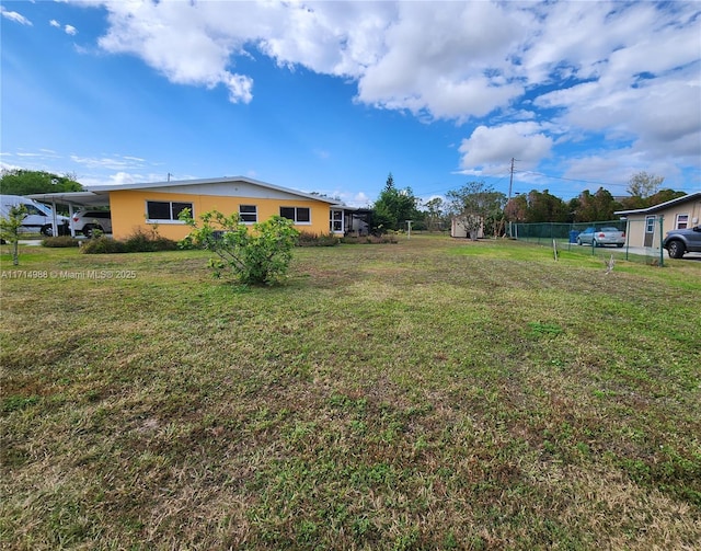 view of yard featuring a carport